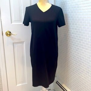 Danskin black shirt sleeve v neckline dress. Nylon/ lycra/Spandex. Size PS. NWOT